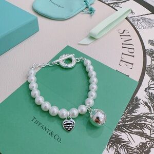 Tiffany & Co. White Pearl Bracelet with Silver Heart and Sphere Charms
